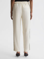 Reiss Trousers | Theo Taper Tapered Fit Side Stripe Trousers Cream - Women