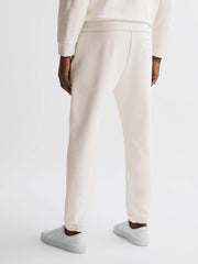 Reiss Trousers | Dawson Reiss | Ché Motif Cotton Drawstring Joggers Off White - Men