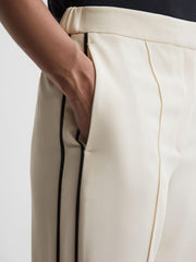 Reiss Trousers | Theo Taper Tapered Fit Side Stripe Trousers Cream - Women